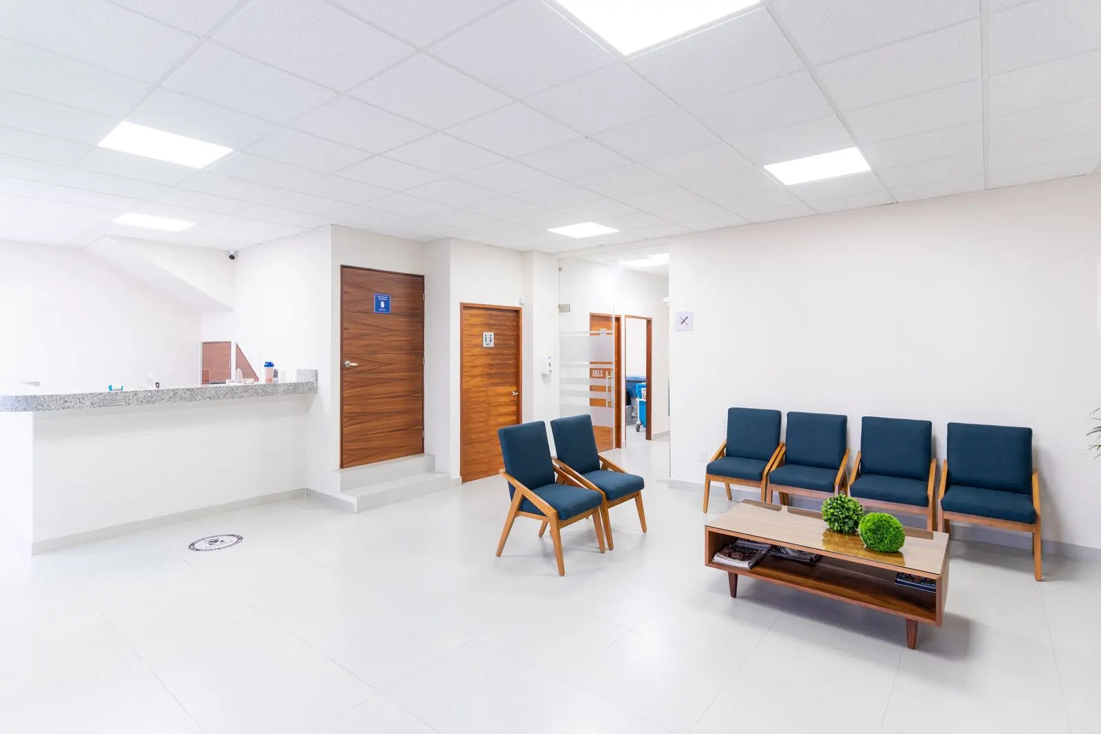 A bright, modern hospital reception and waiting area
